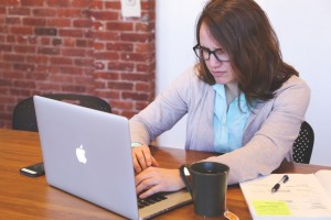 A woman at work on a laptop computer.