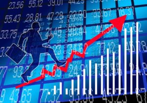 An illustration of a businessman running up the trendline of a financial sheet.